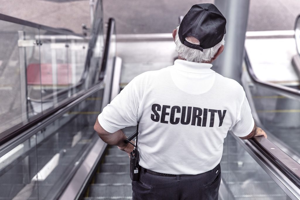 Church Security: Church Safety Teams security, man, escalator-869216.jpg